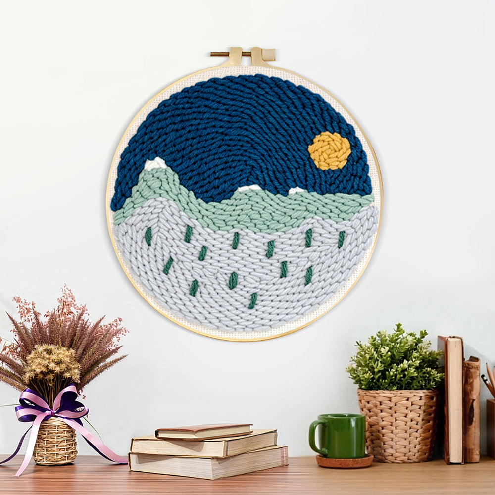 Finished tranquil mountain scenery artwork displayed on a wall