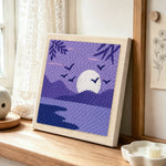 Tranquil purple lake view punch needle artwork displayed on a table