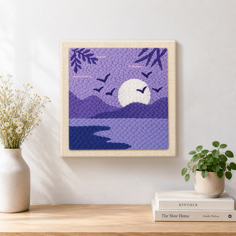 Finished tranquil purple lake view artwork displayed on a wall