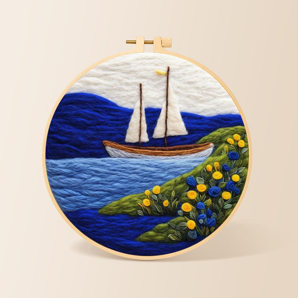 Tranquil white sailboat and floral shoreline needle felting kit for beginners with a round wooden frame