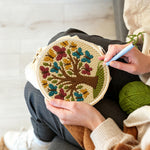 Creating handmade tree of life with colourful butterflies punch needle artwork