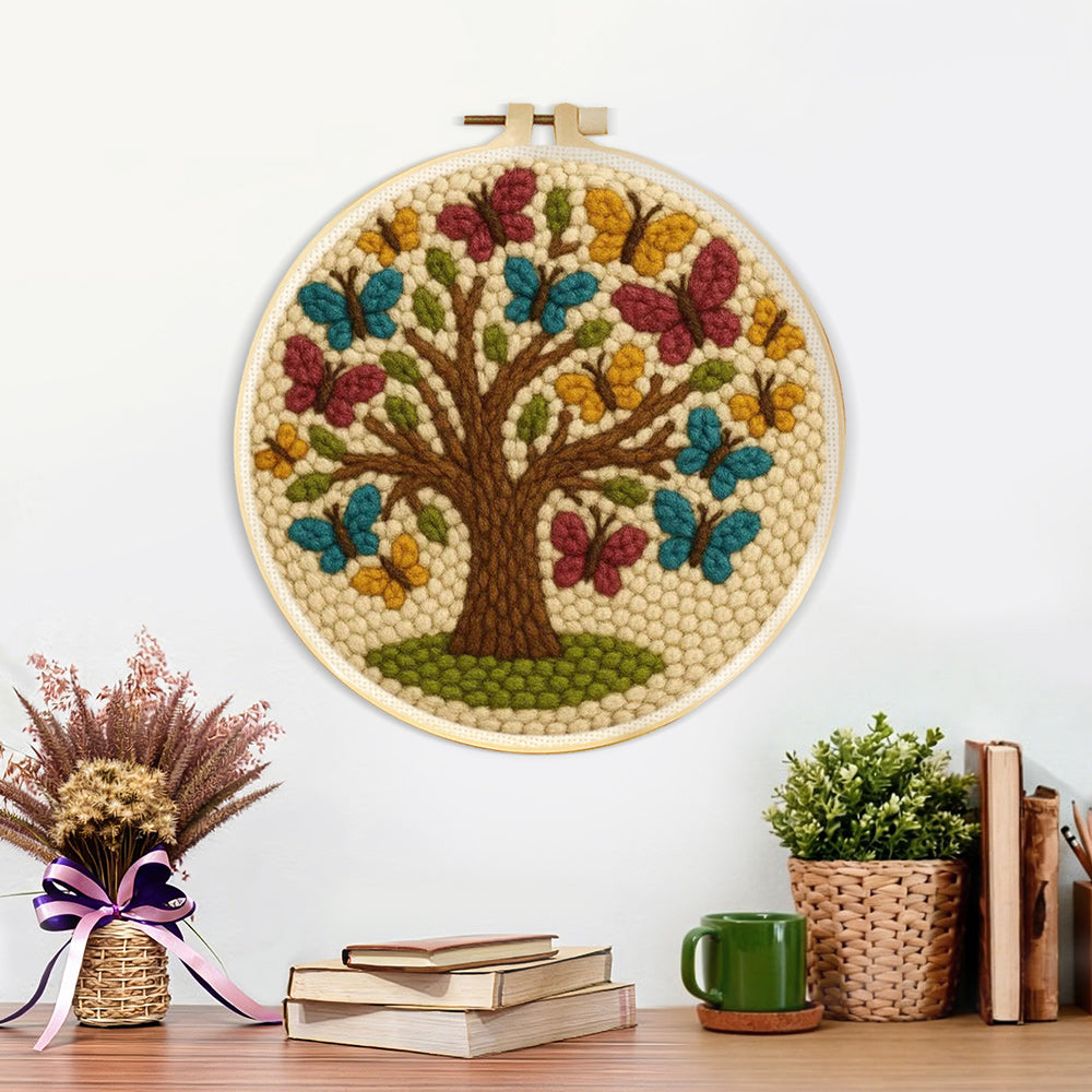 Finished tree of life with colourful butterflies artwork displayed on a wall