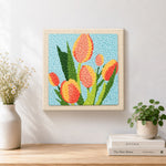 Finished tricolor tulips artwork displayed on a wall