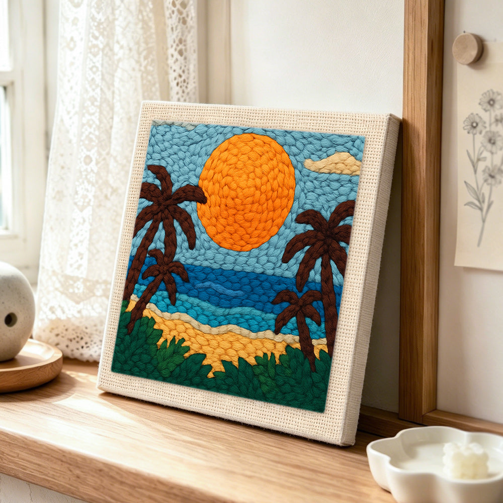 Tropical beach sunset punch needle artwork displayed on a table