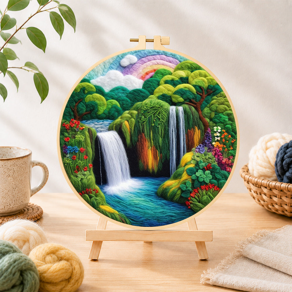 Finished tropical jungle scenery with lush waterfall needle felting displayed on a wooden easel