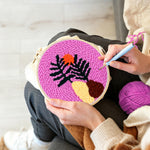 Creating handmade tropical leaf at sunset punch needle artwork
