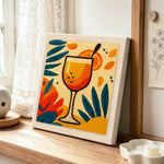 Tropical orange cocktail punch needle artwork displayed on a table