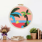 Finished tropical palm tree sunset artwork displayed on a wall