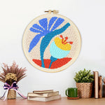 Finished tropical plant and flower artwork displayed on a wall
