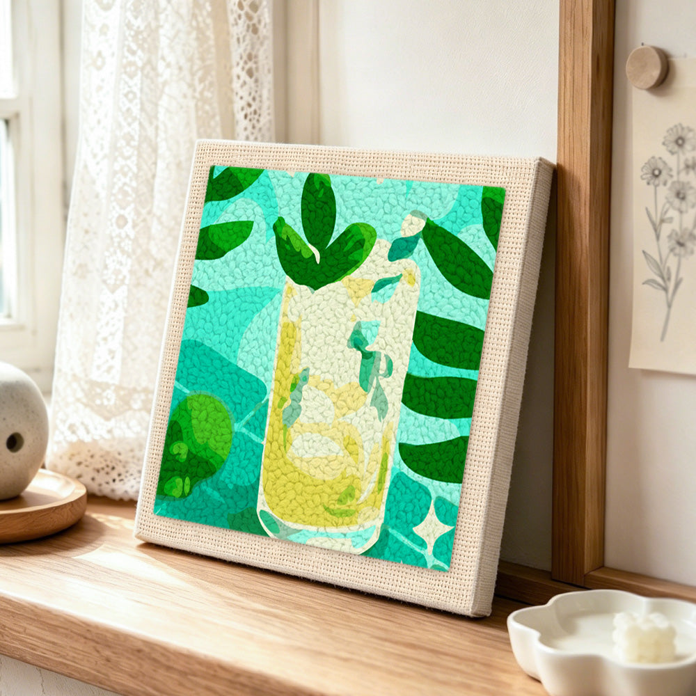 Tropical refreshing cocktail punch needle artwork displayed on a table