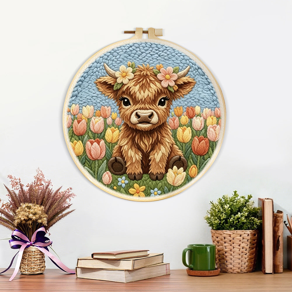 Finished tulip flower highland cow artwork displayed on a wall
