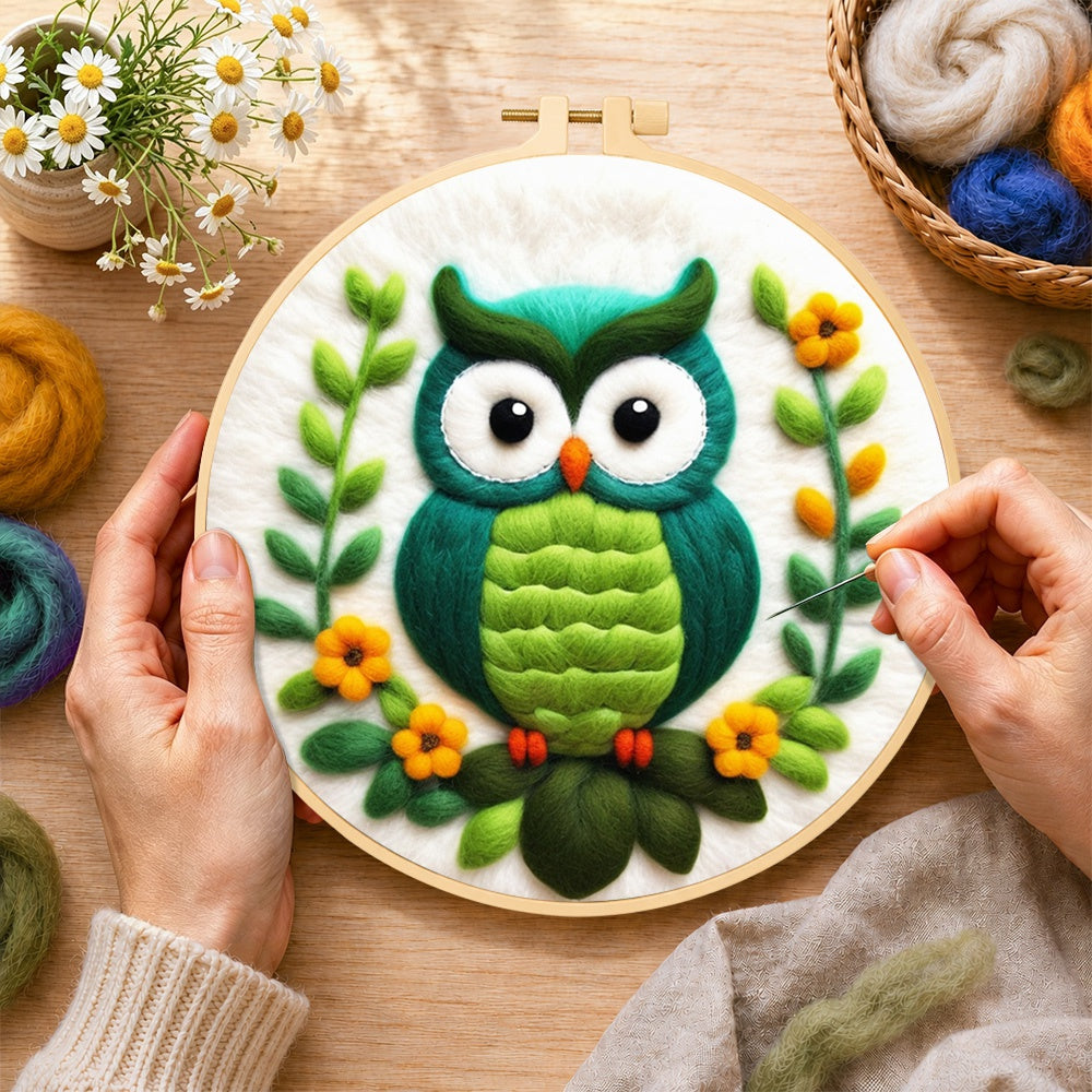Creating the turquoise owl wool painting by hand with a felting needle