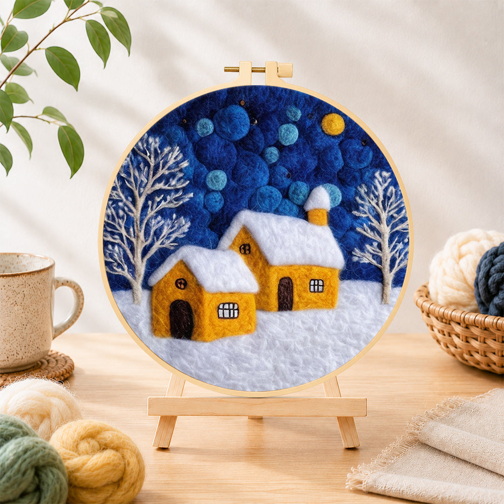 Finished twin yellow cottages under the starry sky needle felting displayed on a wooden easel