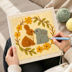Creating handmade two bunnies kissing punch needle artwork