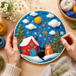 Creating the two christmas cats with red house wool painting by hand with a felting needle