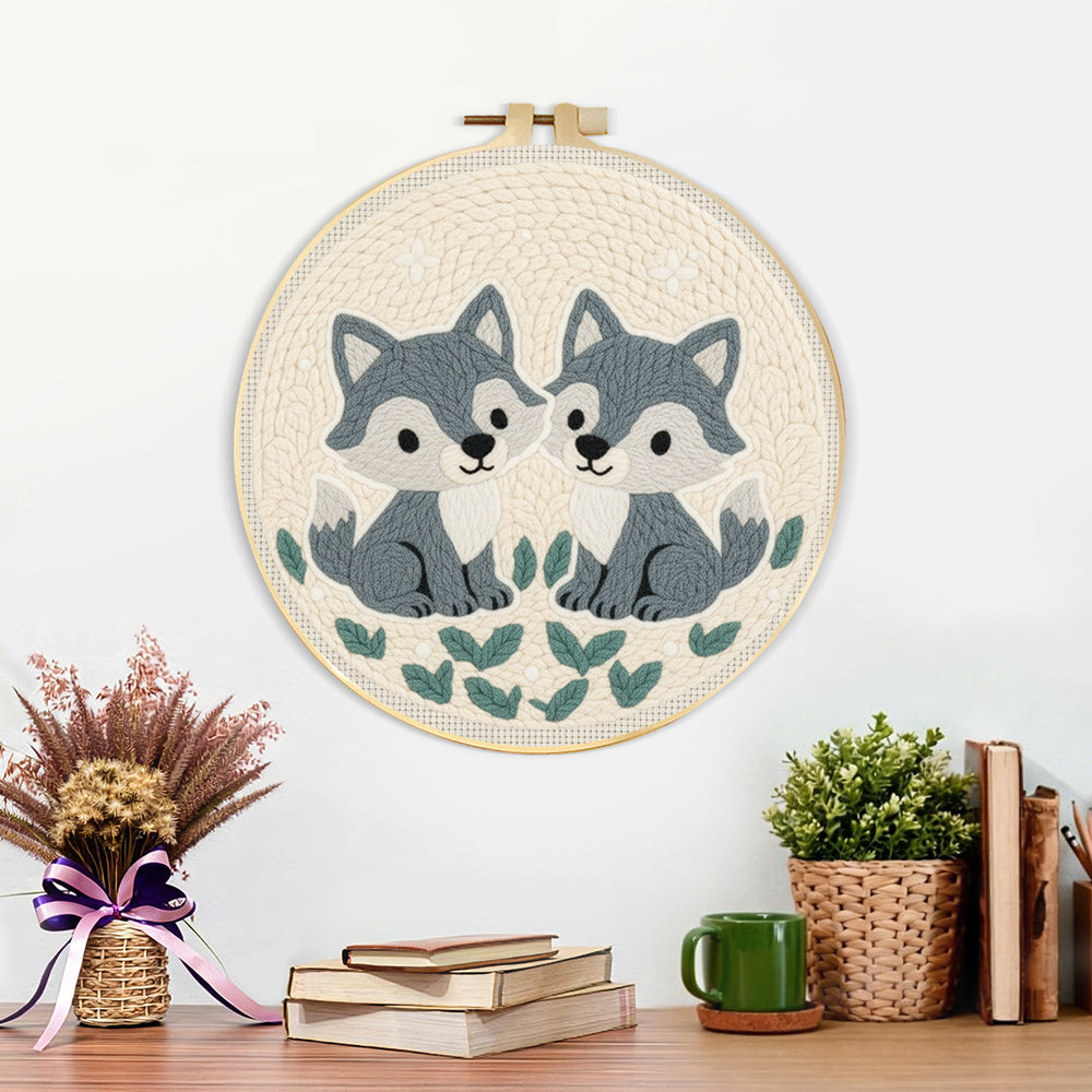 Finished two little grey foxes artwork displayed on a wall