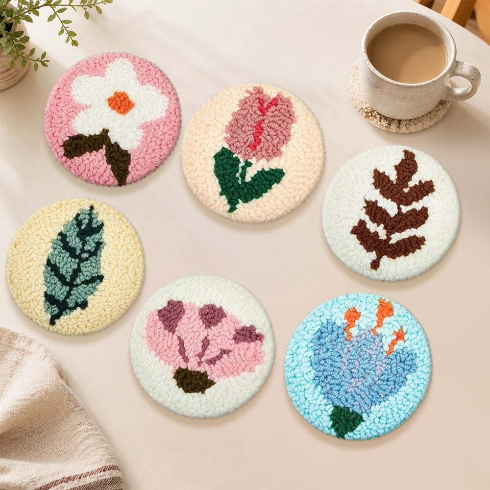 Unique blue flower and fern leaf punch needle coasters used for home decoration