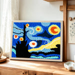 Van Gogh starry night punch needle artwork displayed on a table