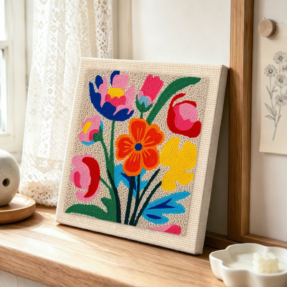Vibrant abstract tulips punch needle artwork displayed on a table
