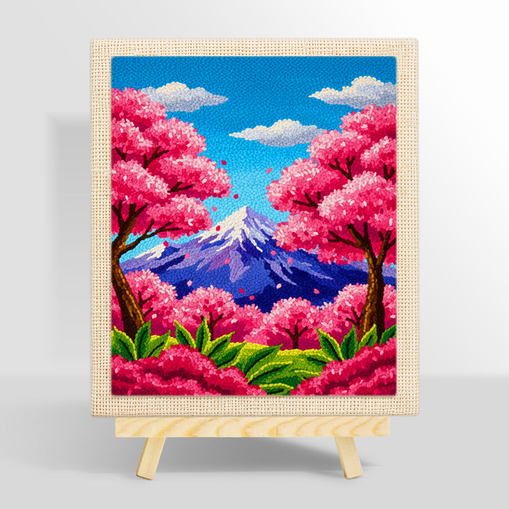Vibrant cherry blossom trees and snowy peak punch needle kit for beginners