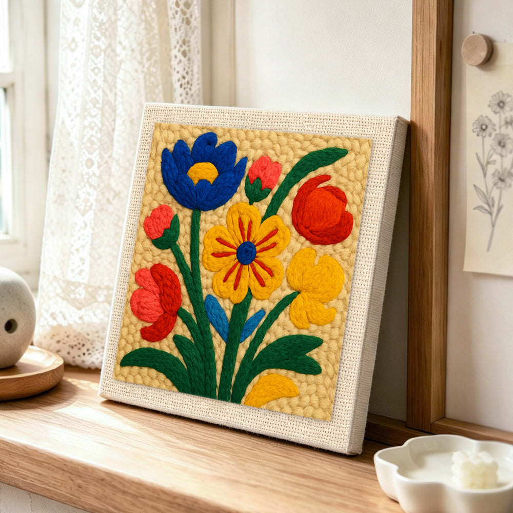 Vibrant colourful florals punch needle artwork displayed on a table