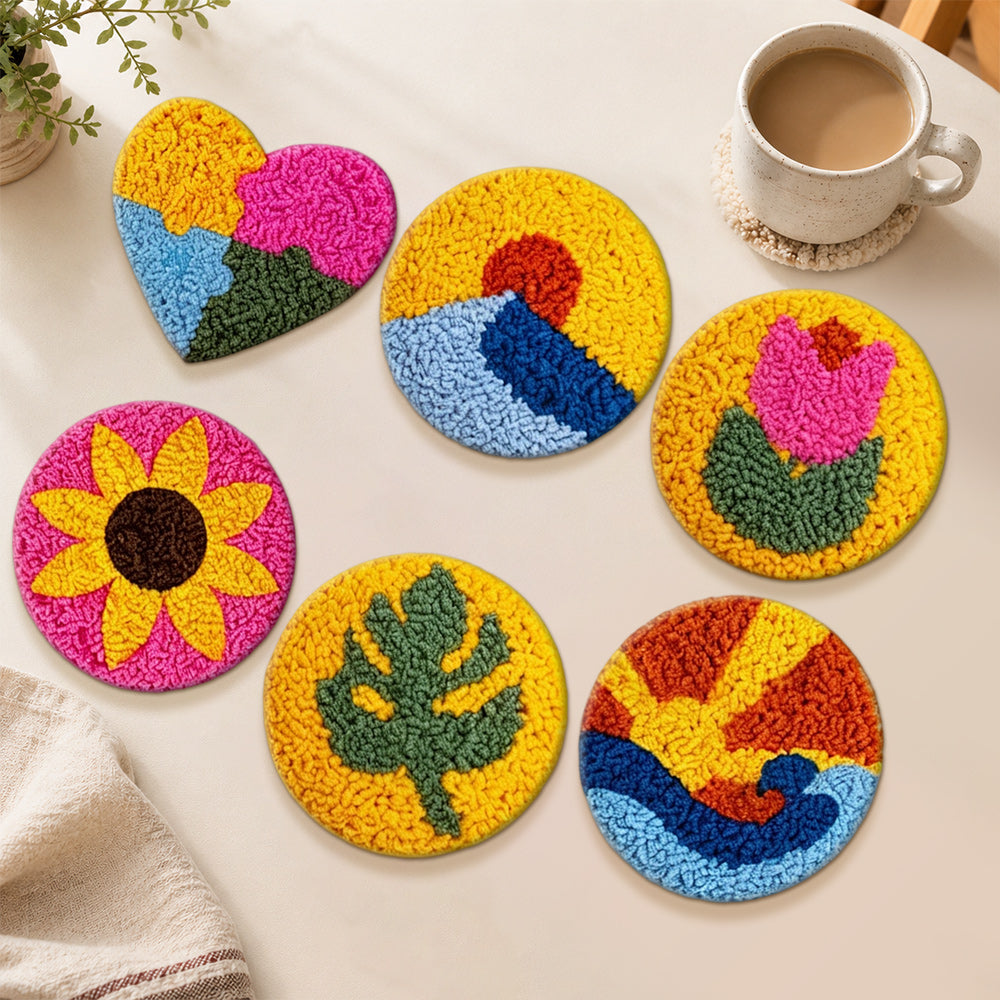 Vibrant flowers, heart and sun punch needle coasters used for home decoration
