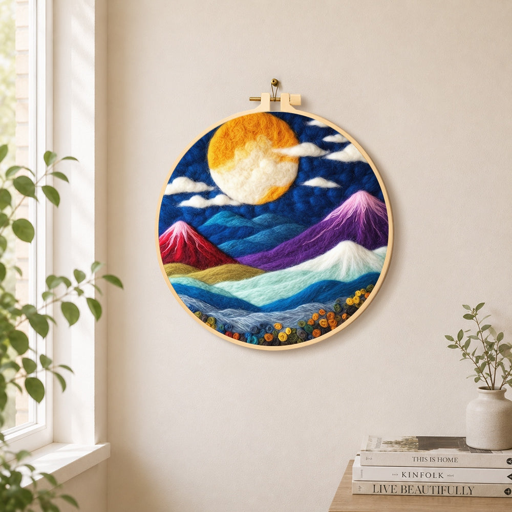 Vibrant full moon over mystical peaks needle felt wall art displayed in a bright home interior