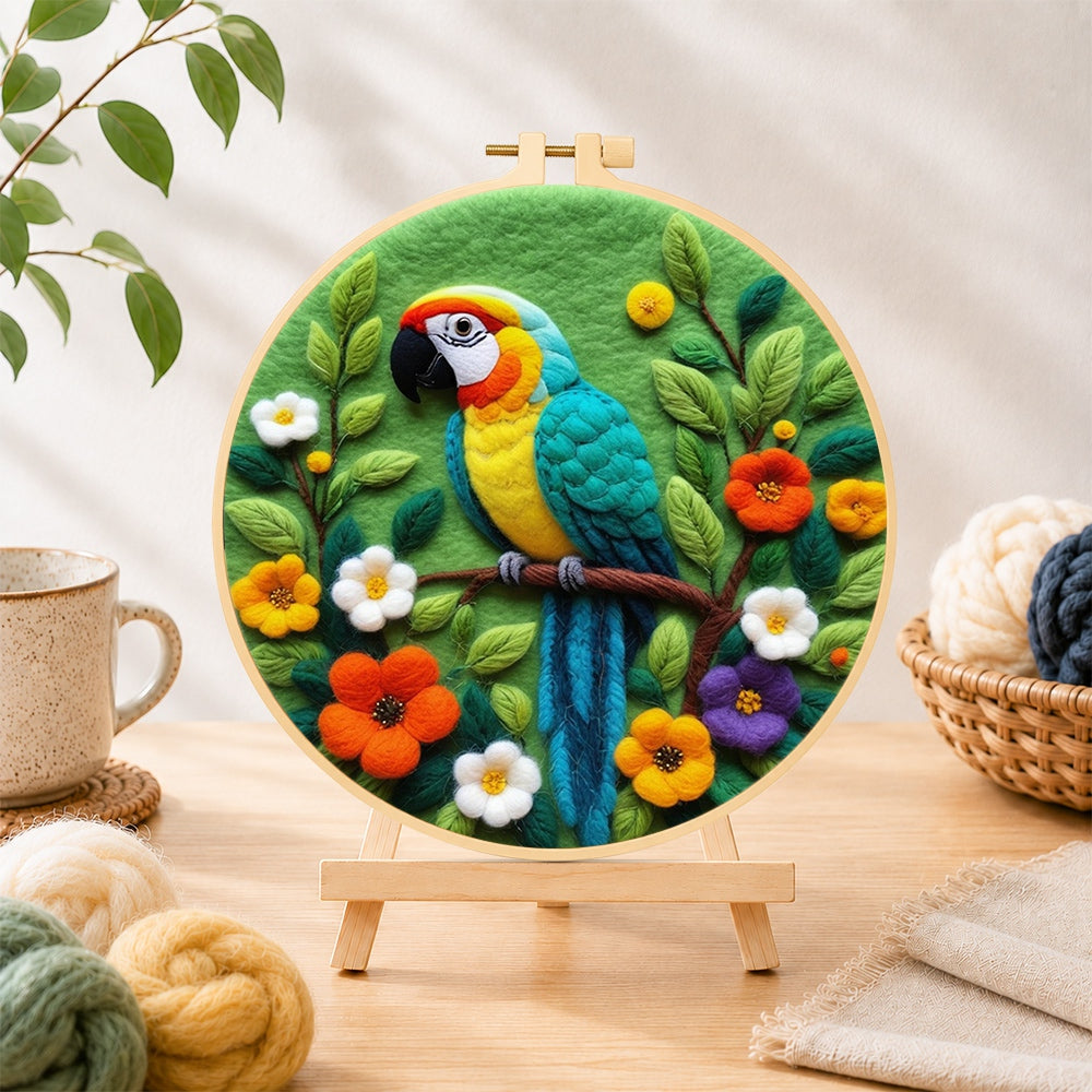 Finished vibrant jungle parrot needle felting displayed on a wooden easel