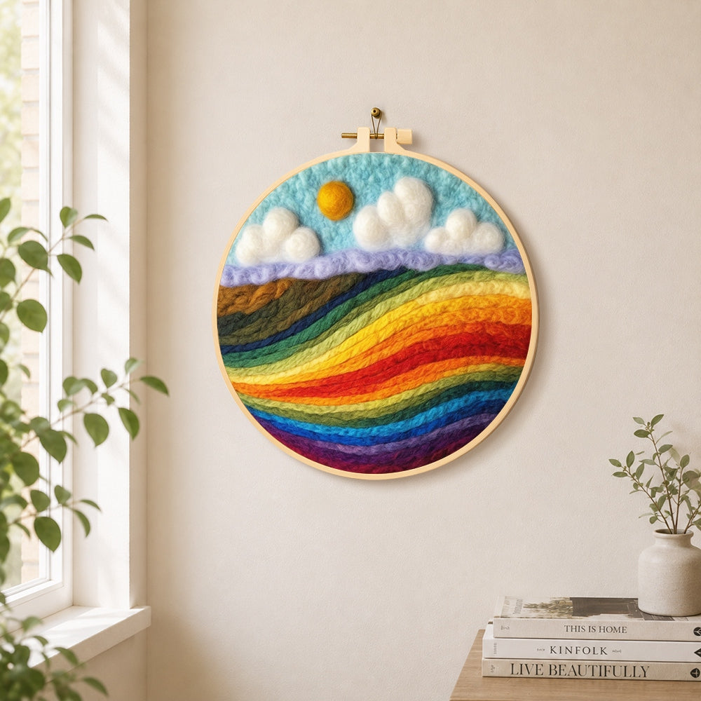 Vibrant rainbow colour block landscape needle felt wall art displayed in a bright home interior