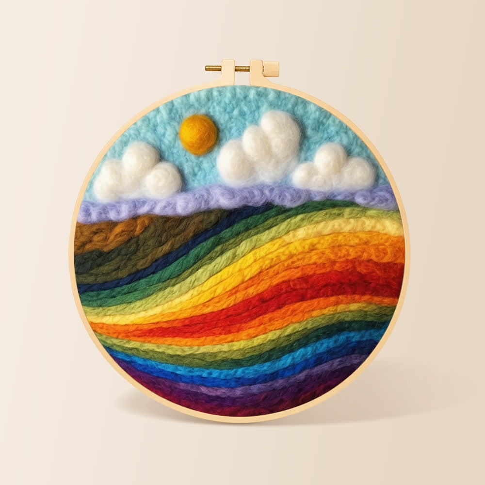 Vibrant rainbow colour block landscape needle felting kit for beginners with a round wooden frame