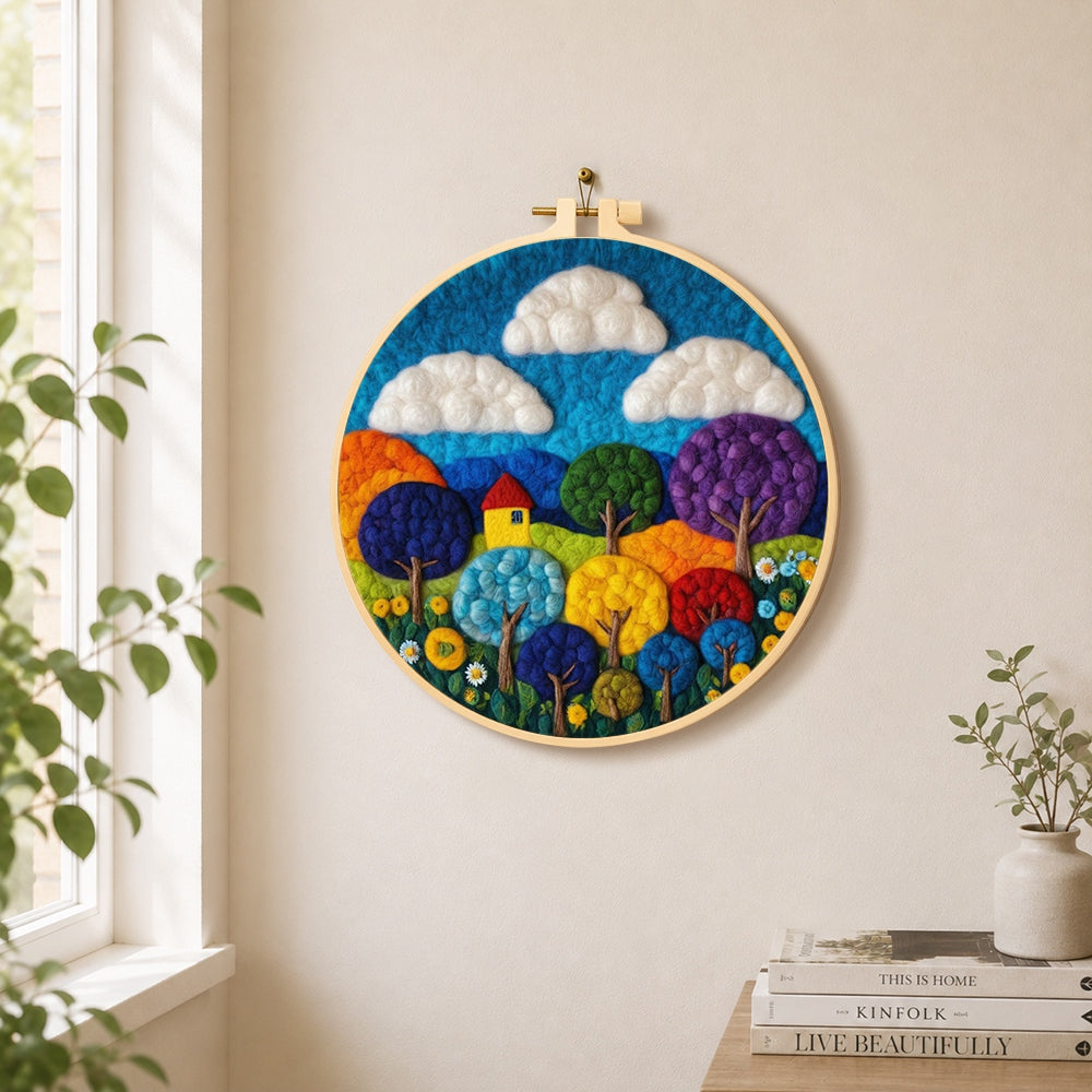 Vibrant rainbow trees needle felt wall art displayed in a bright home interior