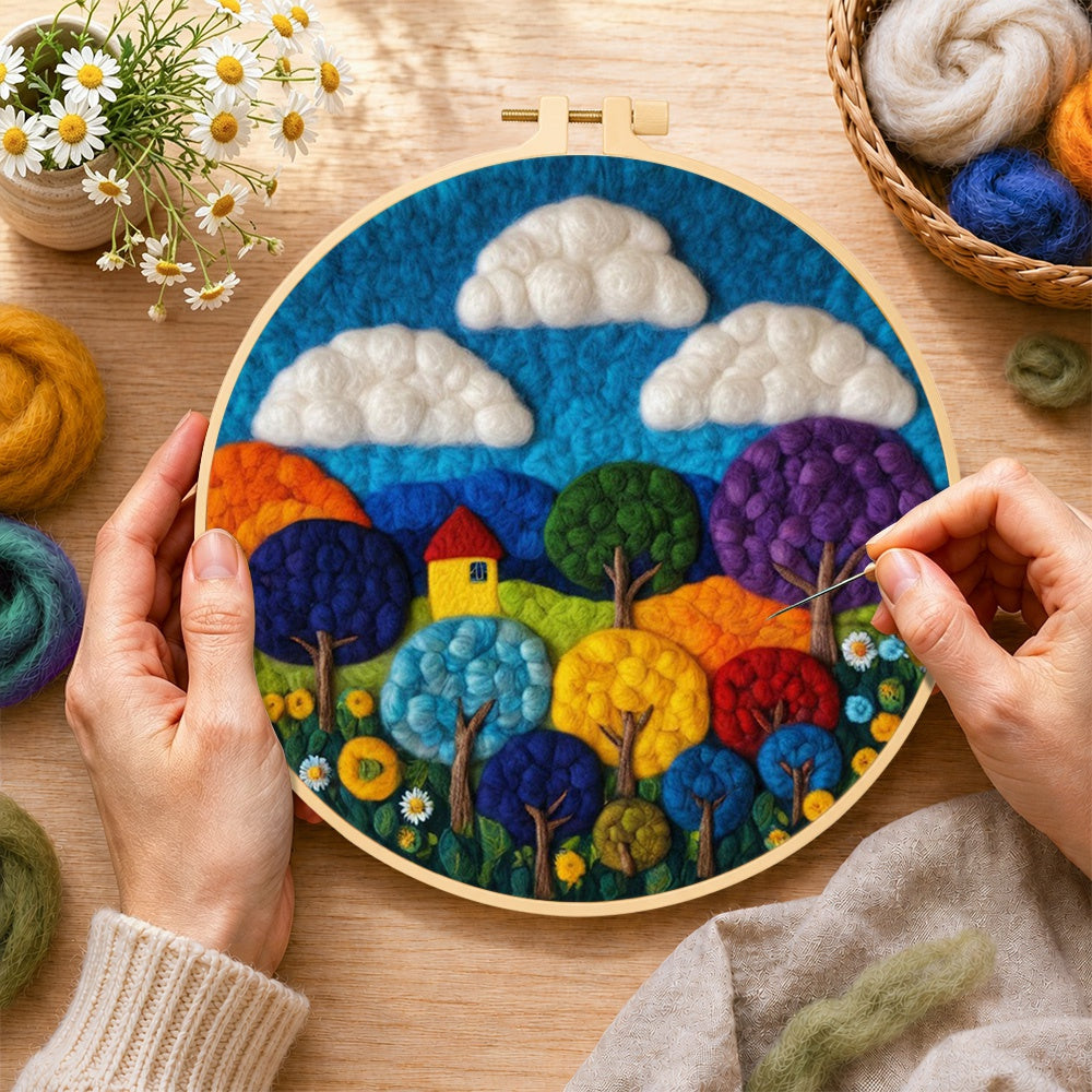 Creating the vibrant rainbow trees wool painting by hand with a felting needle