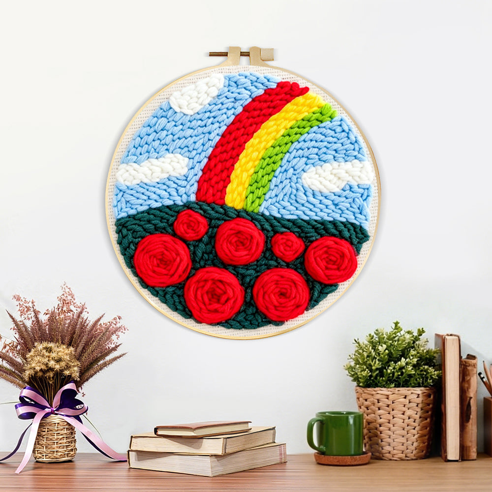 Finished vibrant rainbow with red roses artwork displayed on a wall