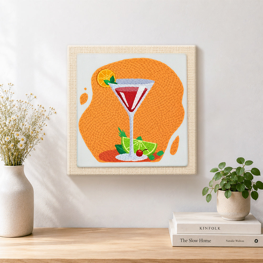 Finished vibrant red cocktail with lime artwork displayed on a wall