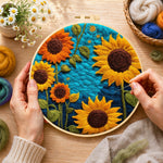 Creating the Vibrant sunflowers on blue wool painting by hand with a felting needle