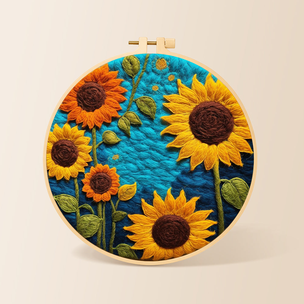 Vibrant sunflowers on blue needle felting kit for beginners with a round wooden frame