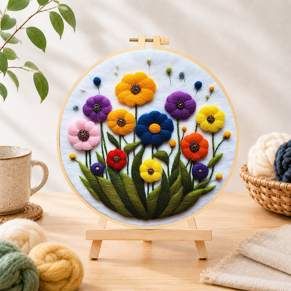 Finished vibrant tall wildflowers needle felting displayed on a wooden easel
