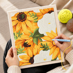 Creating handmade vibrant yellow sunflowers punch needle artwork