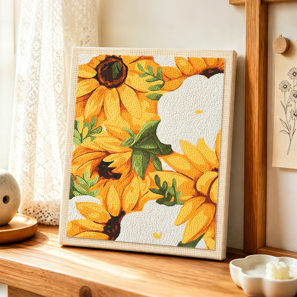 Vibrant yellow sunflowers punch needle artwork displayed on a table