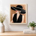 Finished vintage lady in black hat artwork displayed on a wall