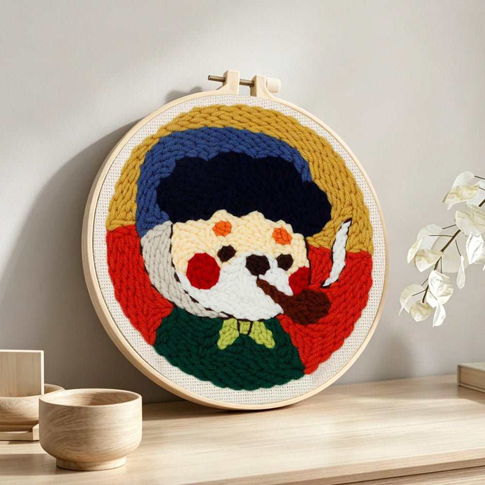 Vintage style cartoon character with pipe punch needle artwork displayed on a table