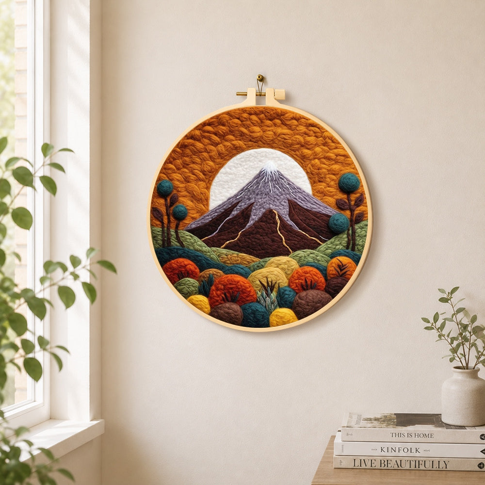 Volcanic mountain under the golden sun needle felt wall art displayed in a bright home interior