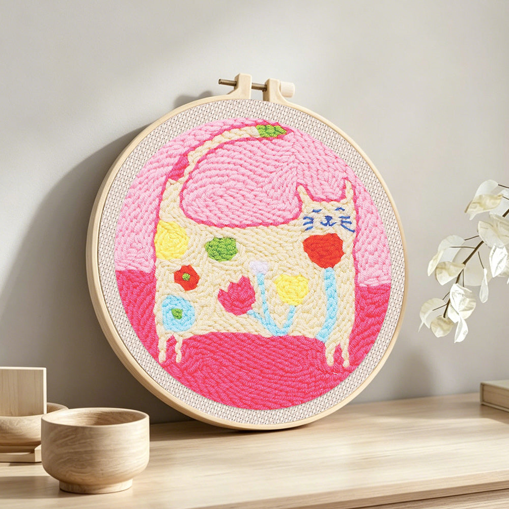 Warm and lovely flower cat punch needle artwork displayed on a table