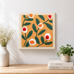 Finished warm apricot floral artwork displayed on a wall