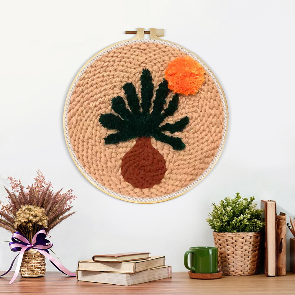 Finished warm boho desert plant artwork displayed on a wall