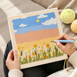 Creating handmade warm golden sunlight and flowers punch needle artwork