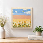Finished warm golden sunlight and flowers artwork displayed on a wall