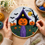 Creating the weird pumpkin head house wool painting by hand with a felting needle