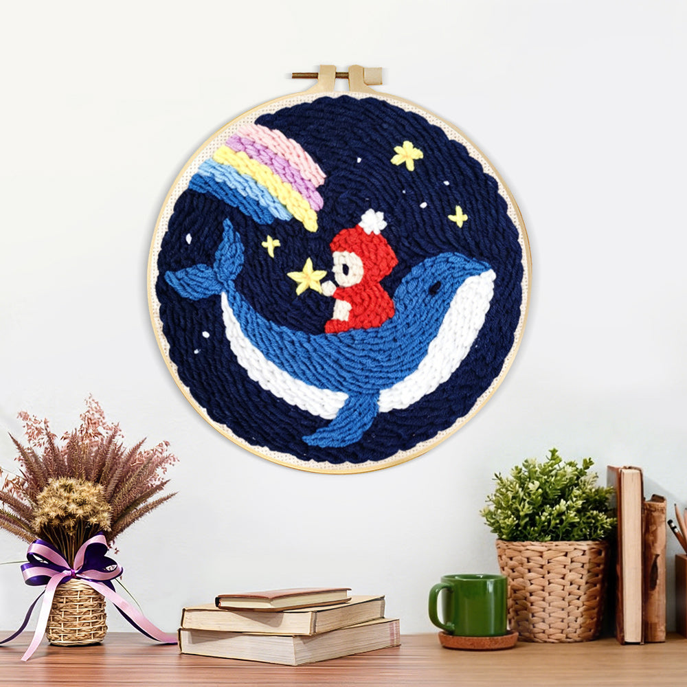Finished whale and astronaut in starry night sky artwork displayed on a wall