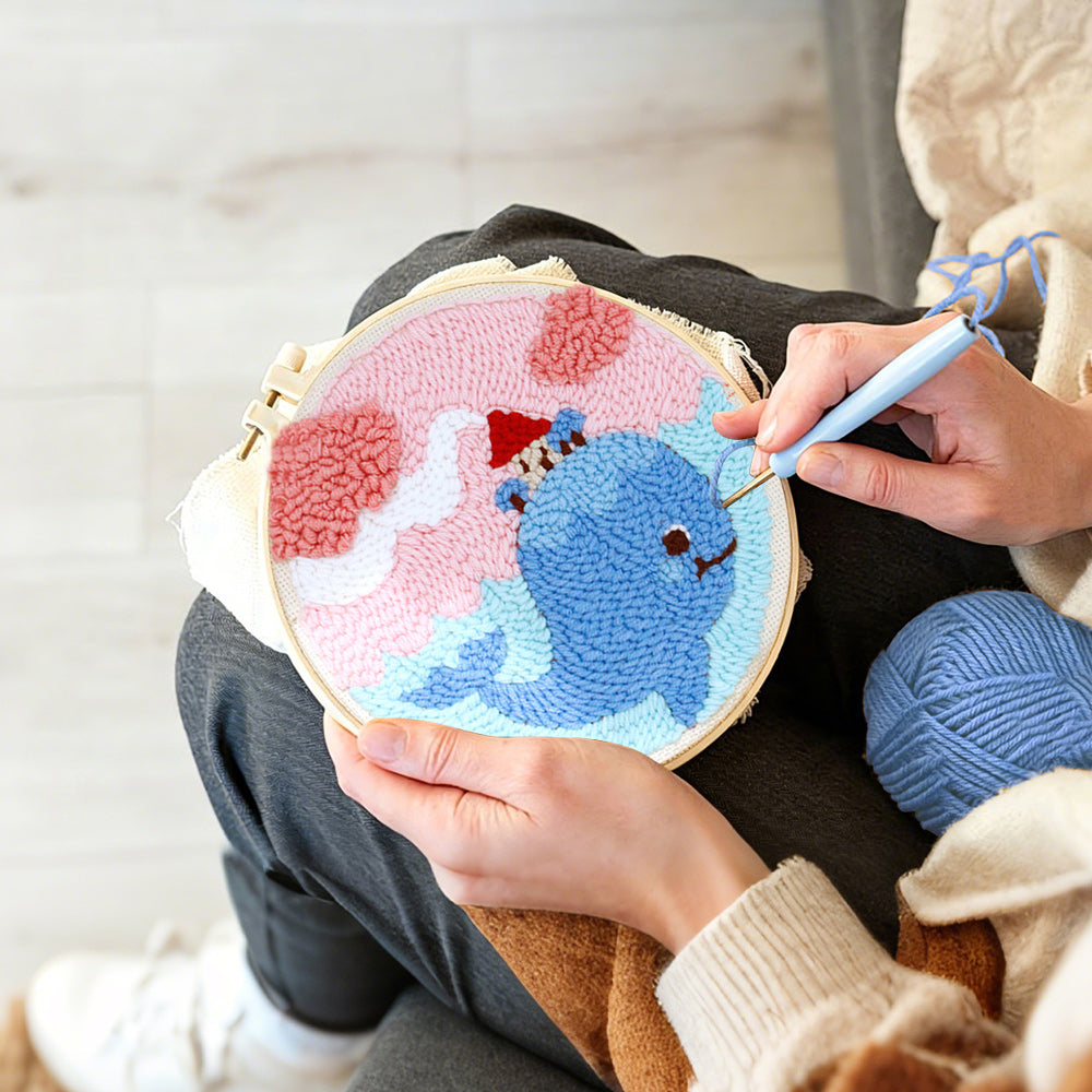 Creating handmade whale carrying a small house in dreamy sky punch needle artwork